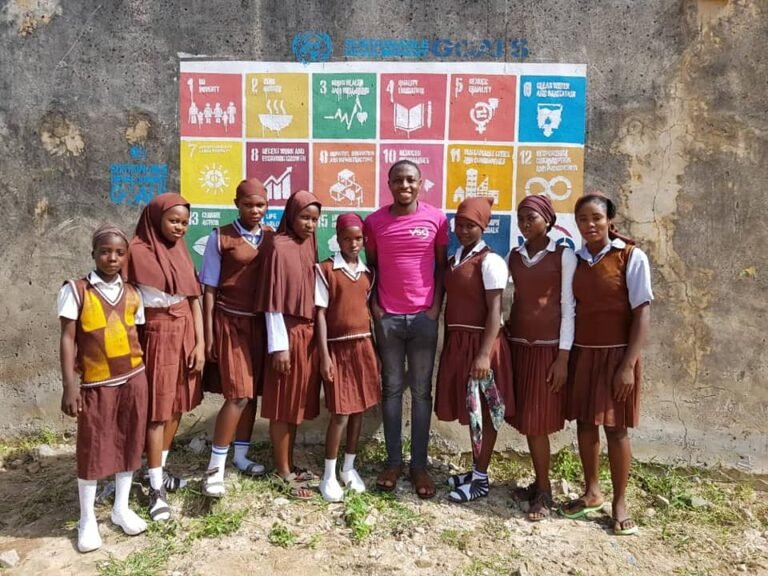AAP with some female students after he painted the SDGs mural in a secondary school in Doma, Nasarawa State, Nigeria