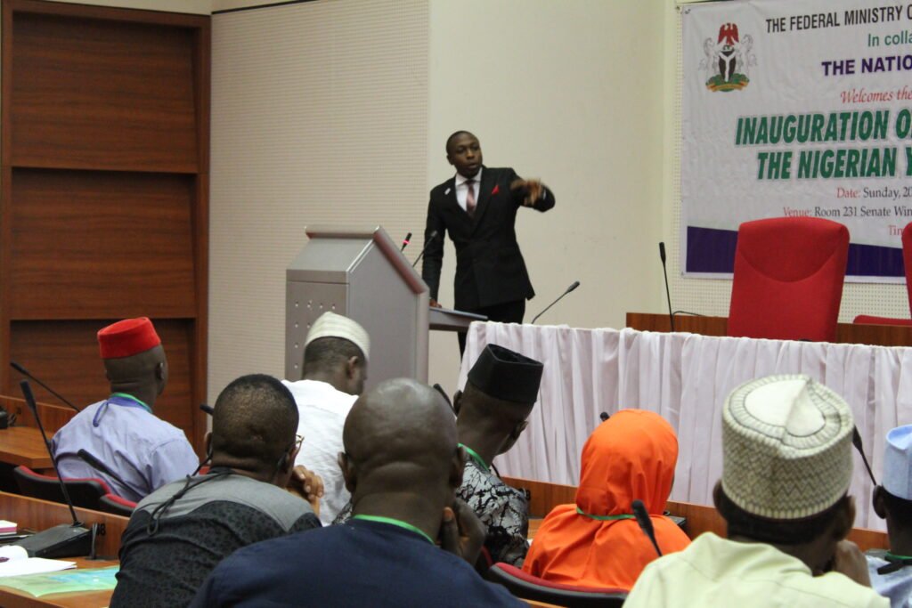Aaron delivering a speech at the National Assembly complex, Abuja, Nigeria to the members of the Nigerian Youth Parliament